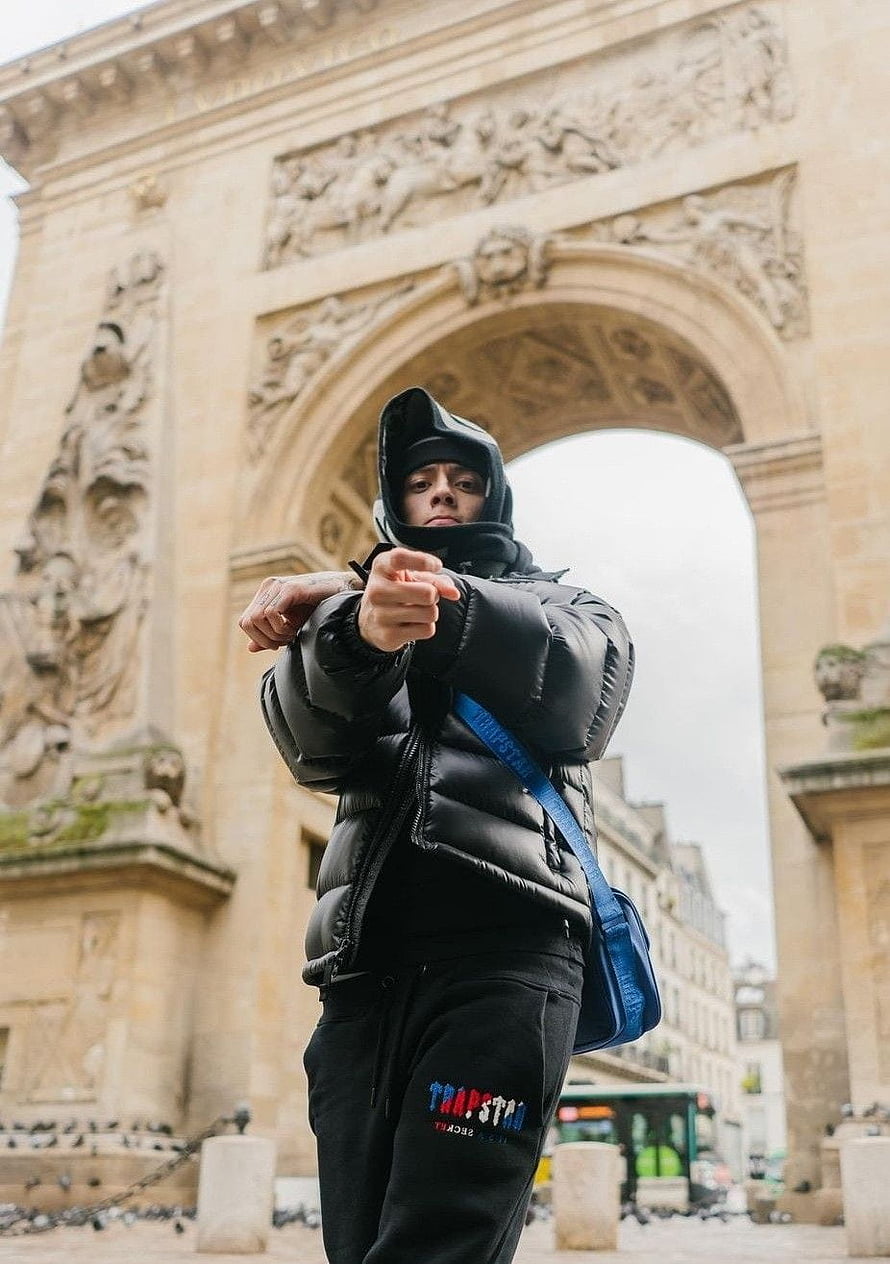 Central Cee in Black Puffer Jacket and Hoodie at the Arc de Triomphe in Paris HD phone wallpaper
