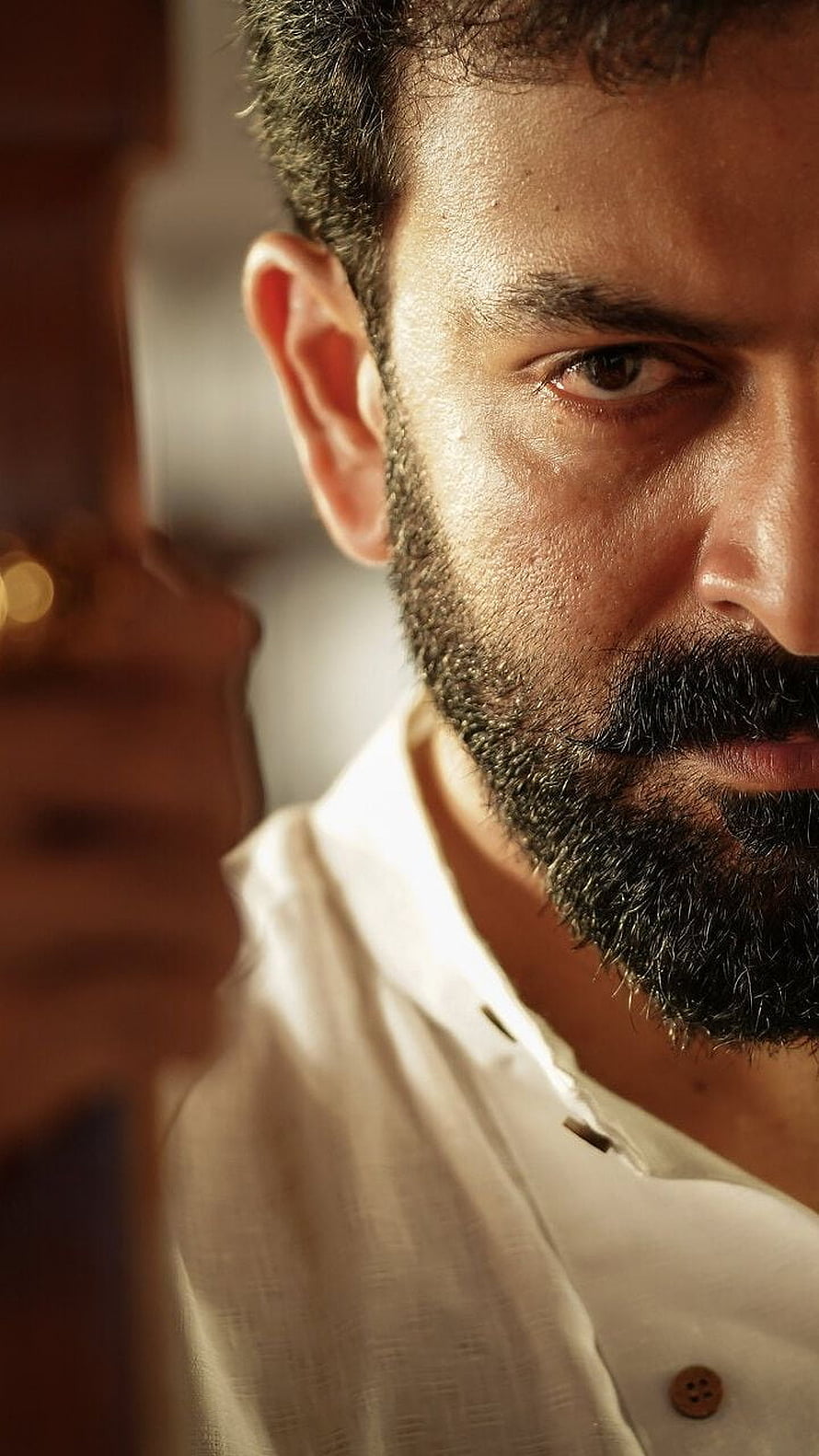 Prithviraj in Kaduva: Intense Close-Up Portrait of the Malayalam Actor HD phone wallpaper