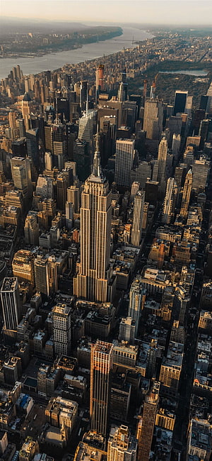 Aerial View of the Empire State Building and Manhattan Skyline at Golden Hour HD phone wallpaper