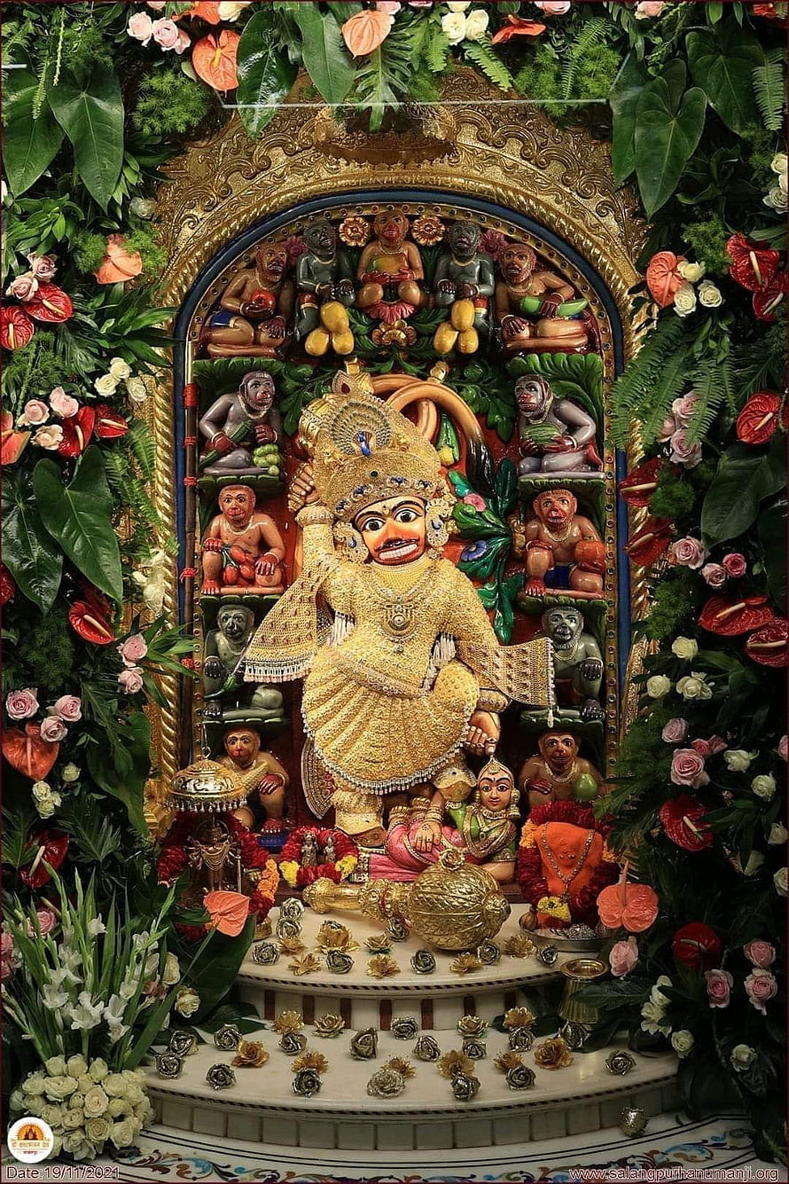 Kasturbhanjan Dev Murti Adorned With Flowers And Monkeys In Temple Setting HD phone wallpaper