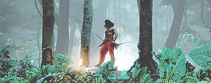 Ram Charan as Alluri Sitarama Raju in RRR cinematic jungle scene with bow and arrow HD wallpaper