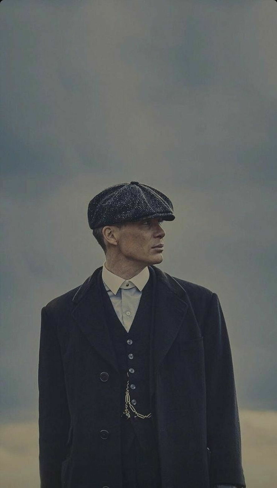 Tommy Shelby in Peaky Blinders Vintage Flat Cap and Dark Overcoat HD phone wallpaper