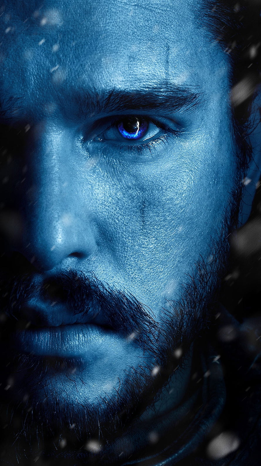 Jon Snow Close-Up Portrait with Glowing Blue Eye in Snowfall HD phone wallpaper