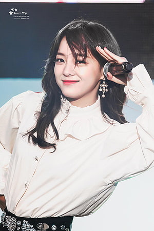 Kim Se Jeong Performing on Stage in White Blouse and Statement Earrings HD phone wallpaper