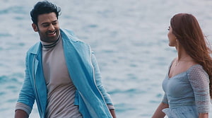 Prabhas and Pooja Hegde in Romantic Coastal Scene from Radhe Shyam HD wallpaper