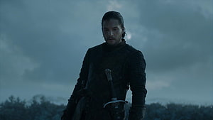 Jon Snow in Dark Armor with Sword Under Stormy Sky from Game of Thrones HD wallpaper