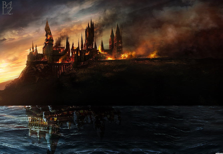 Hogwarts Castle Enveloped in Flames and Smoke at Dusk HD wallpaper