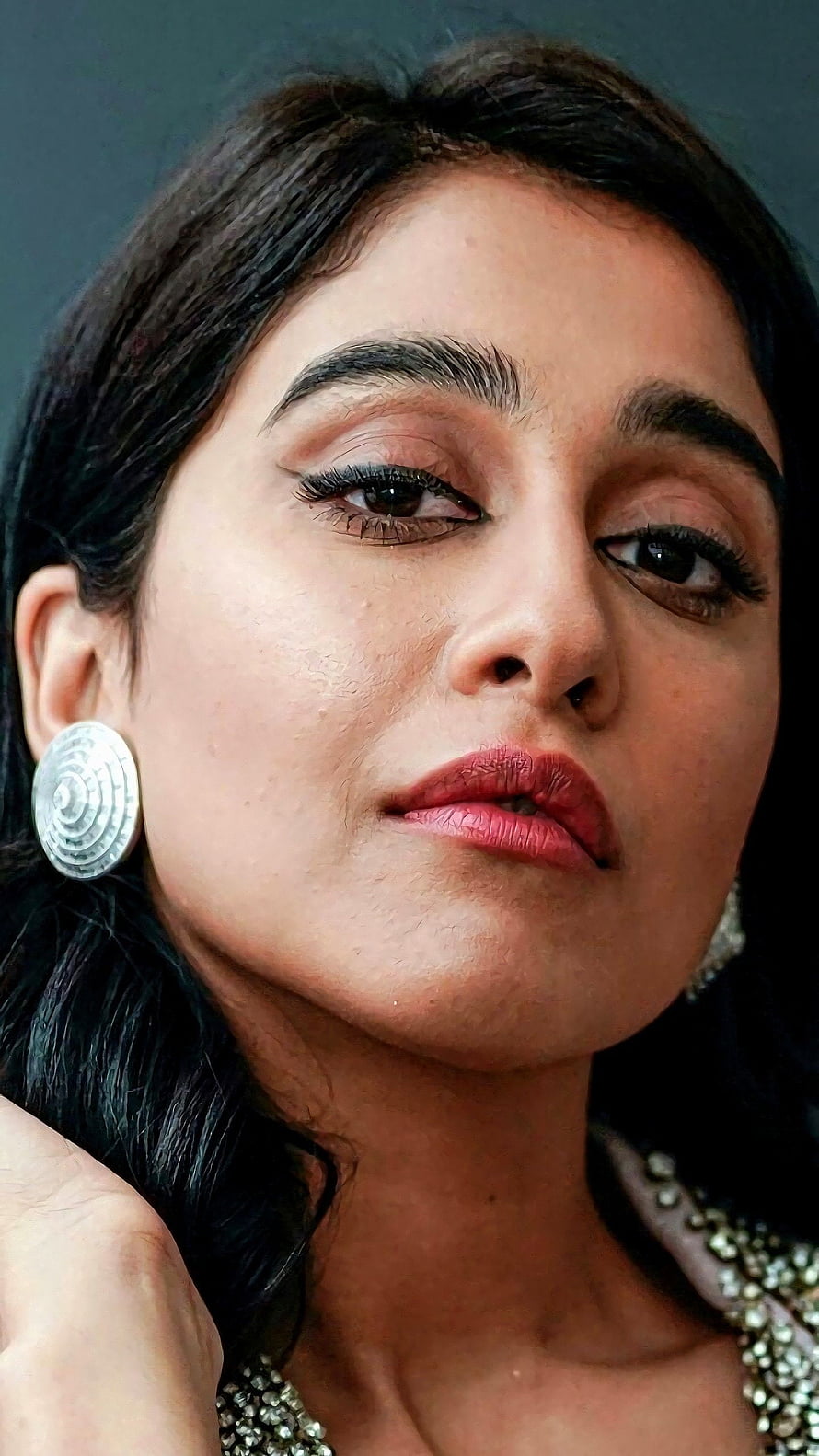 Regina Cassandra Close-Up Portrait with Silver Earrings and Beaded Necklace HD phone wallpaper