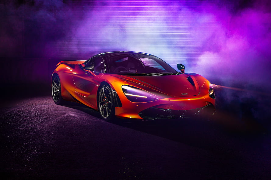 McLaren 720S Super Car in Vibrant Orange with Purple Neon Smoke and Dramatic Studio Lighting HD wallpaper