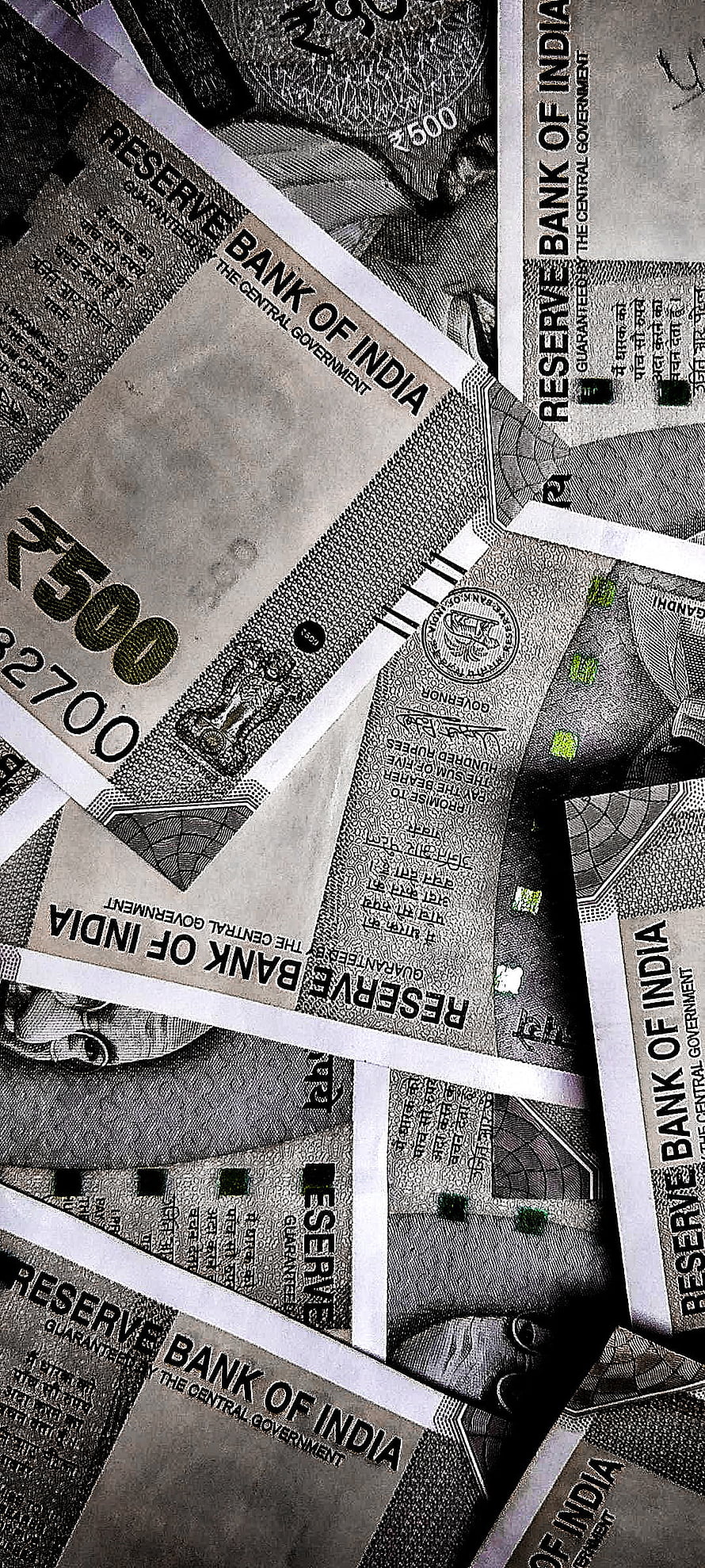 Close-up of Indian 500 Rupee Banknotes Scattered in Monochrome HD phone wallpaper