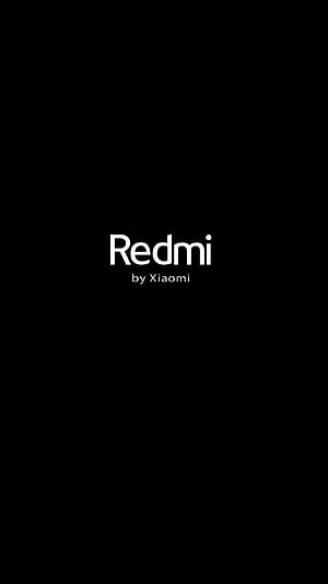 Minimalist Redmi by Xiaomi Brand Logo on Solid Black Background HD phone wallpaper