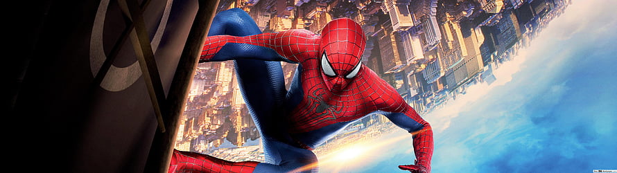 Spider-Man Swinging Over City Skyline in Classic Red and Blue Suit HD wallpaper