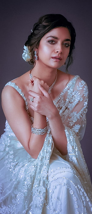 Keerthy Suresh in Elegant White Bridal Lehenga with Diamond Jewelry and Floral Hairpiece HD phone wallpaper