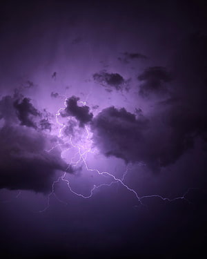 Violet Lightning Storm: Dramatic Purple Thunderclouds and Electric Bolts HD phone wallpaper