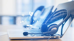 Modern Call Center Headset on Laptop with Digital Communication Icons and Voip Interface HD wallpaper
