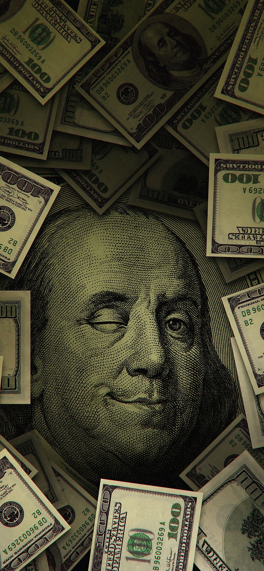 Close-up of Benjamin Franklin portrait on scattered US one hundred dollar bills with dark moody aesthetic HD phone wallpaper