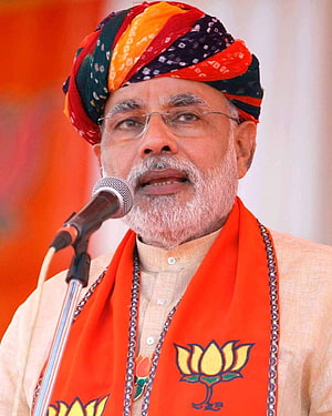 Narendra Modi Speaking at a Political Rally Wearing a Colorful Turban and BJP Saffron Scarf HD phone wallpaper