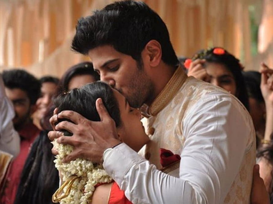 Dulquer Salmaan and Nithya Menen in a romantic wedding scene from O Kadhal Kanmani HD wallpaper