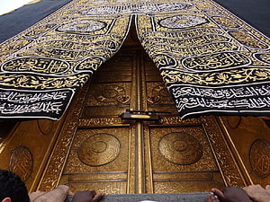 Ornate Golden Kaaba Door with Black Kiswa and Arabic Calligraphy HD wallpaper