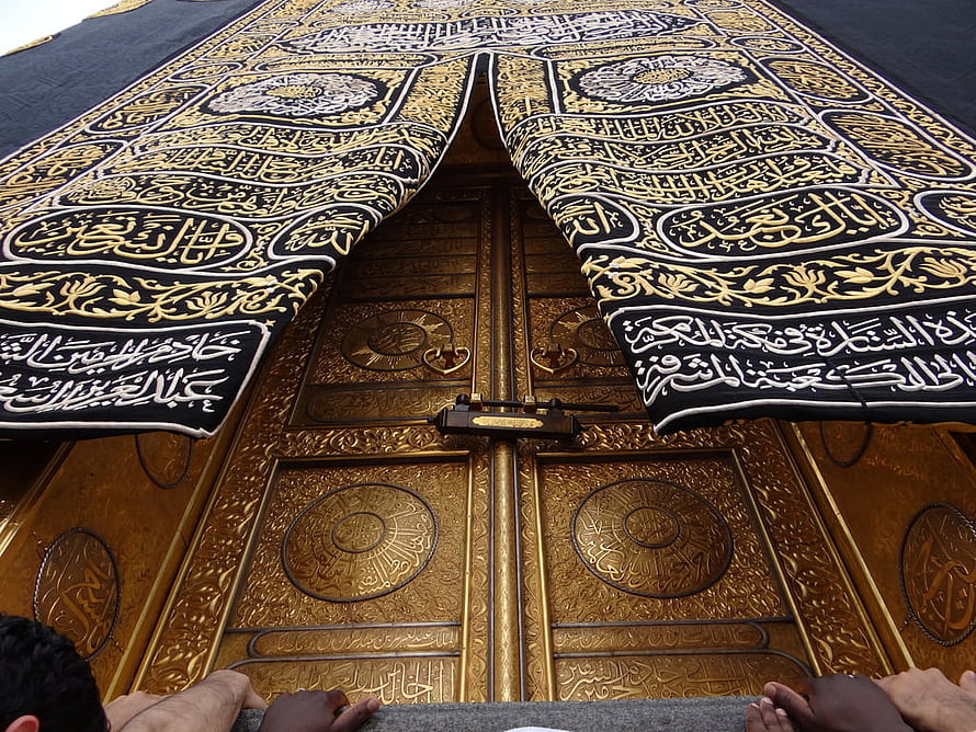 Ornate Golden Kaaba Door with Black Kiswa and Arabic Calligraphy HD wallpaper