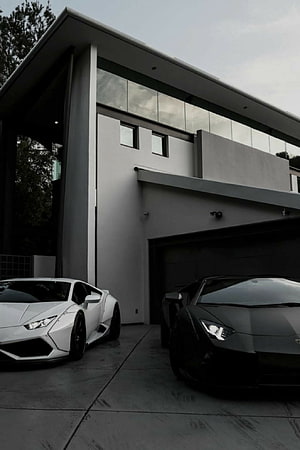 White and Black Lamborghini Aventador Parked in Modern Luxury Garage HD phone wallpaper