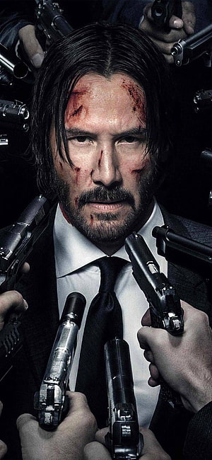 Keanu Reeves as John Wick Surrounded by Guns in Dark Suit HD phone wallpaper