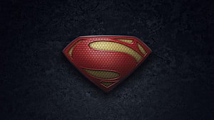 Superman S-Shield Emblem from Man of Steel on Dark Textured Background HD wallpaper