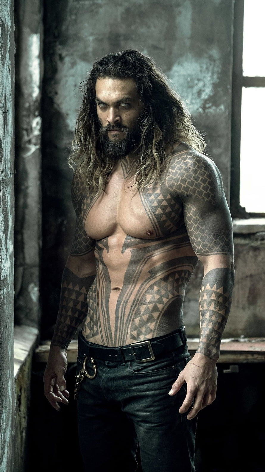 Jason Momoa as Aquaman with Tribal Tattoos in Dark Industrial Setting HD phone wallpaper
