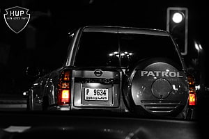 Nissan Patrol Rear View at Night with Dubai License Plate and Spare Tire Cover HD wallpaper