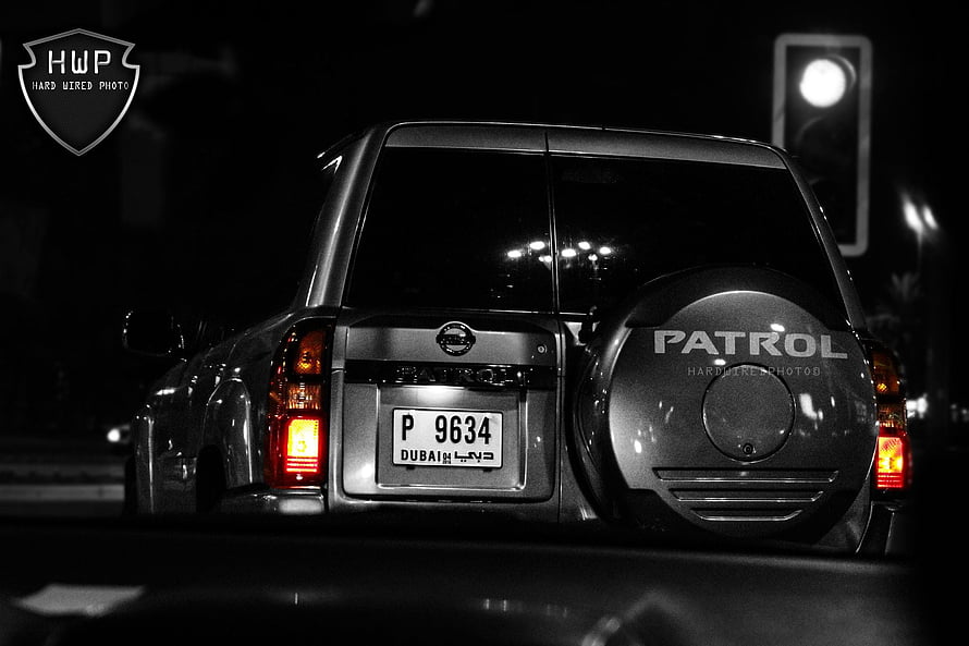 Nissan Patrol Rear View at Night with Dubai License Plate and Spare Tire Cover HD wallpaper