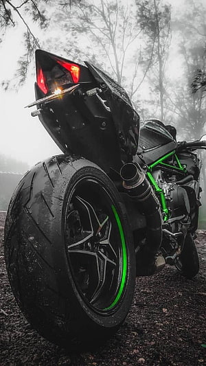 Kawasaki Ninja H2 Rear Profile in Foggy Forest with Green Frame Accents HD phone wallpaper