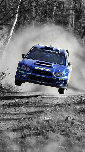 Subaru Impreza WRC Rally Car Mid-Air Jump on Gravel Forest Stage HD phone wallpaper