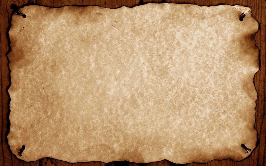 Aged Parchment Scroll with Burnt Edges on Rustic Wooden Surface HD wallpaper
