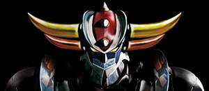 Goldrake Mecha Portrait with Golden Horns and Red Crest on Black Background HD wallpaper