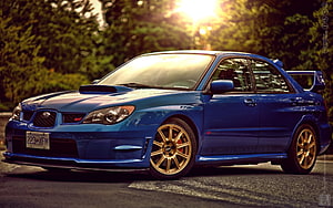 Blue Subaru Impreza WRX STI with Gold Wheels Parked on a Road at Sunset HD wallpaper