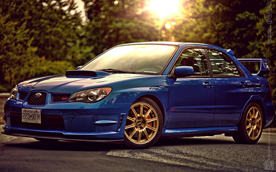 Blue Subaru Impreza WRX STI with Gold Wheels Parked on a Road at Sunset HD wallpaper