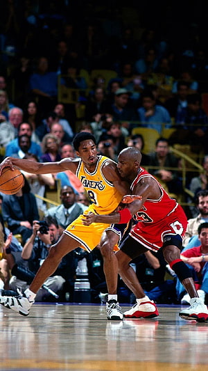 Kobe Bryant and Michael Jordan Face Off in Intense NBA Basketball Match HD phone wallpaper
