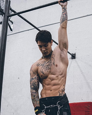 Chris Heria Performing Calisthenics Workout in Gym HD phone wallpaper