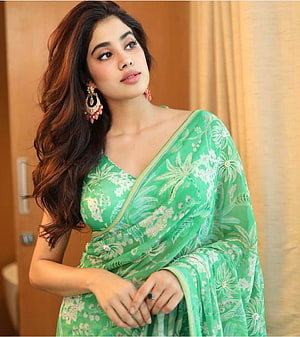 Jhanvi Kapoor in an elegant green floral embroidered saree with traditional jhumka earrings HD phone wallpaper