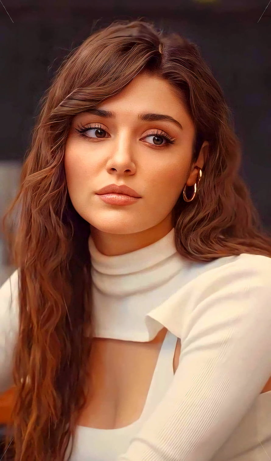 Hande Erceel Portrait in White Turtleneck with Wavy Hair and Gold Hoop Earrings HD phone wallpaper