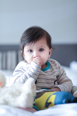 Adorable Baby Boy With Finger In Mouth Wearing Striped Shirt HD phone wallpaper