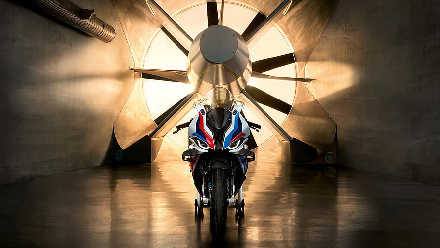 BMW M 1000 RR Superbike in Wind Tunnel with Dramatic Lighting HD wallpaper