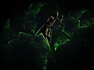 Loki from Marvel's The Avengers in a dark scene with glowing green energy shards and his iconic horned helmet HD wallpaper