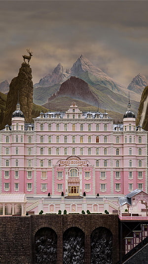 Grand Budapest Hotel Pink Facade Set Piece with Alpine Mountain Backdrop HD phone wallpaper