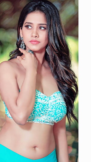 Nabha Natesh in a Turquoise Floral Crop Top and Matching Skirt HD phone wallpaper
