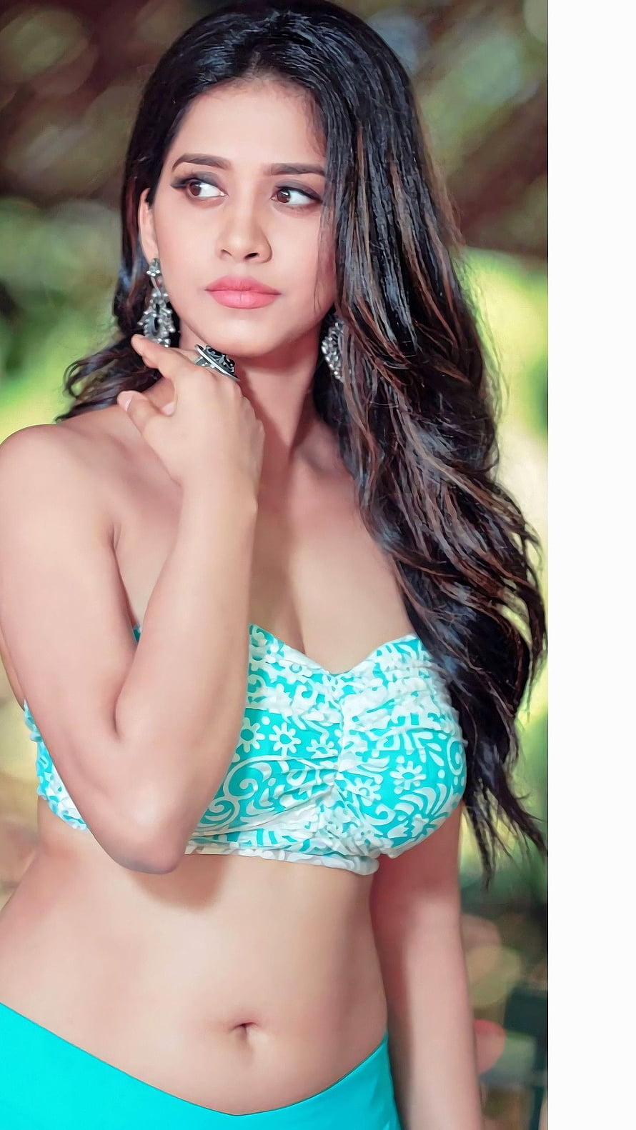 Nabha Natesh in a Turquoise Floral Crop Top and Matching Skirt HD phone wallpaper