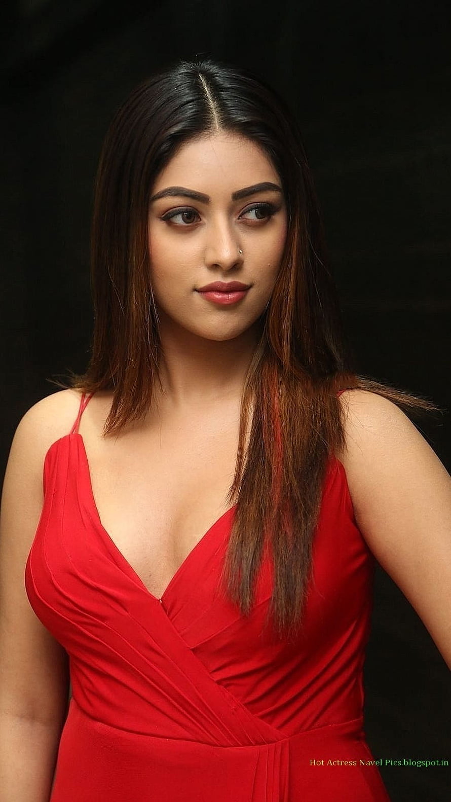 Anu Emmanuel in a Red Wrap Dress with Long Dark Hair and Studio Portrait HD phone wallpaper
