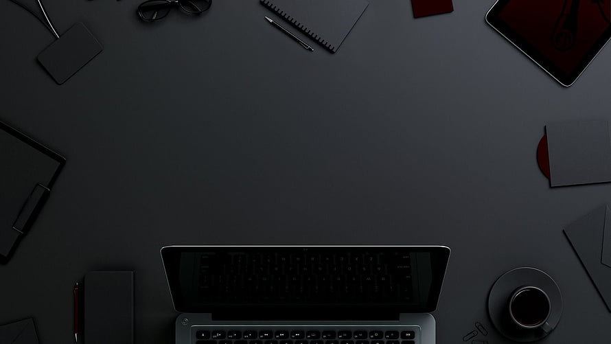 Dark Minimalist Workspace With Laptop, Coffee, and Desk Accessories HD wallpaper