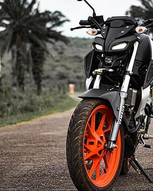 Yamaha MT15 V2 Streetfighter Motorcycle with Orange Wheels on a Gravel Road HD phone wallpaper