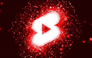 Glowing YouTube Shorts Logo With Red Particle Explosion And Neon Light Effects HD wallpaper